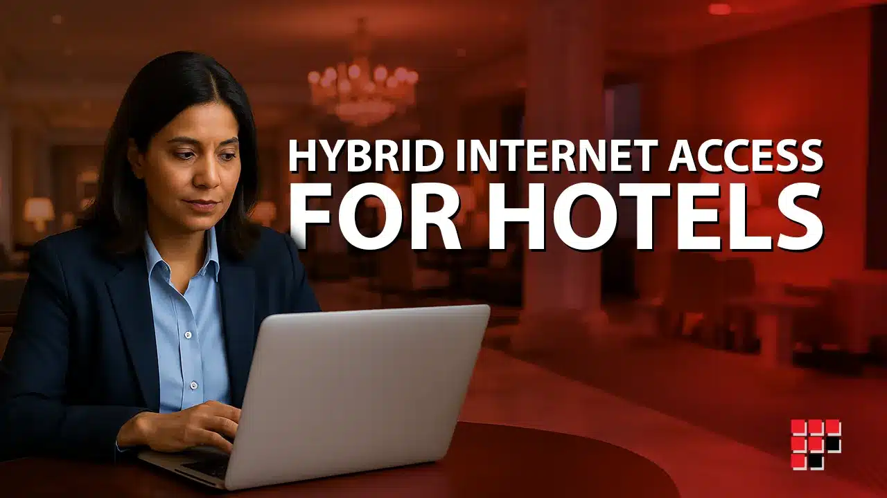 Woman working on a laptop in a hotel lounge illustrating hotel connectivity